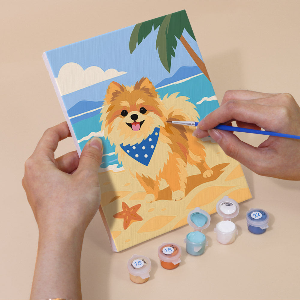 Hand holding a Pomeranian Days mini canvas while painting the details