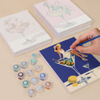 Painting one of the Poolside Cocktails designs next to a stack of mini canvases