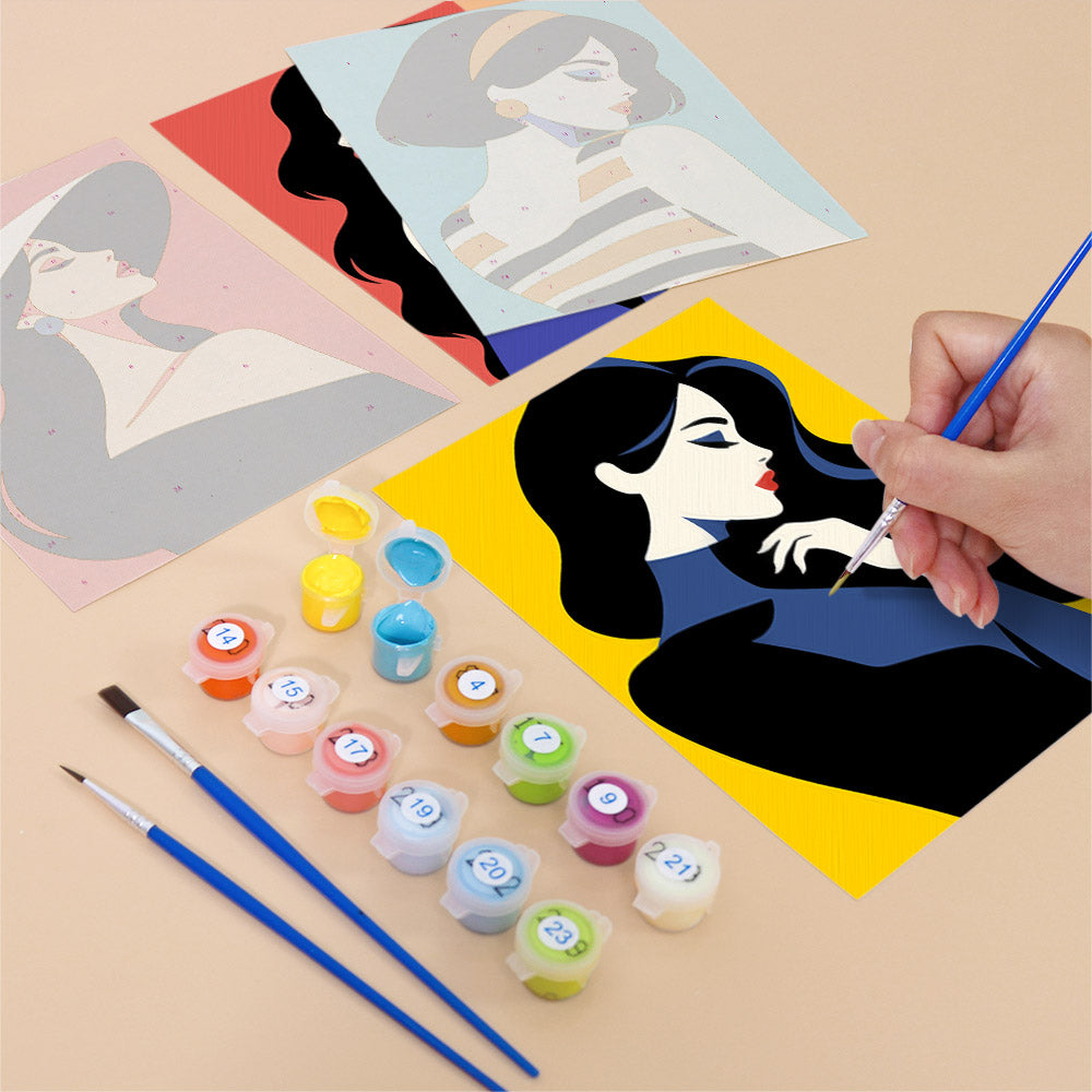 Filling in a Pop Art Ladies mini canvas with numbered acrylic paints and a fine brush