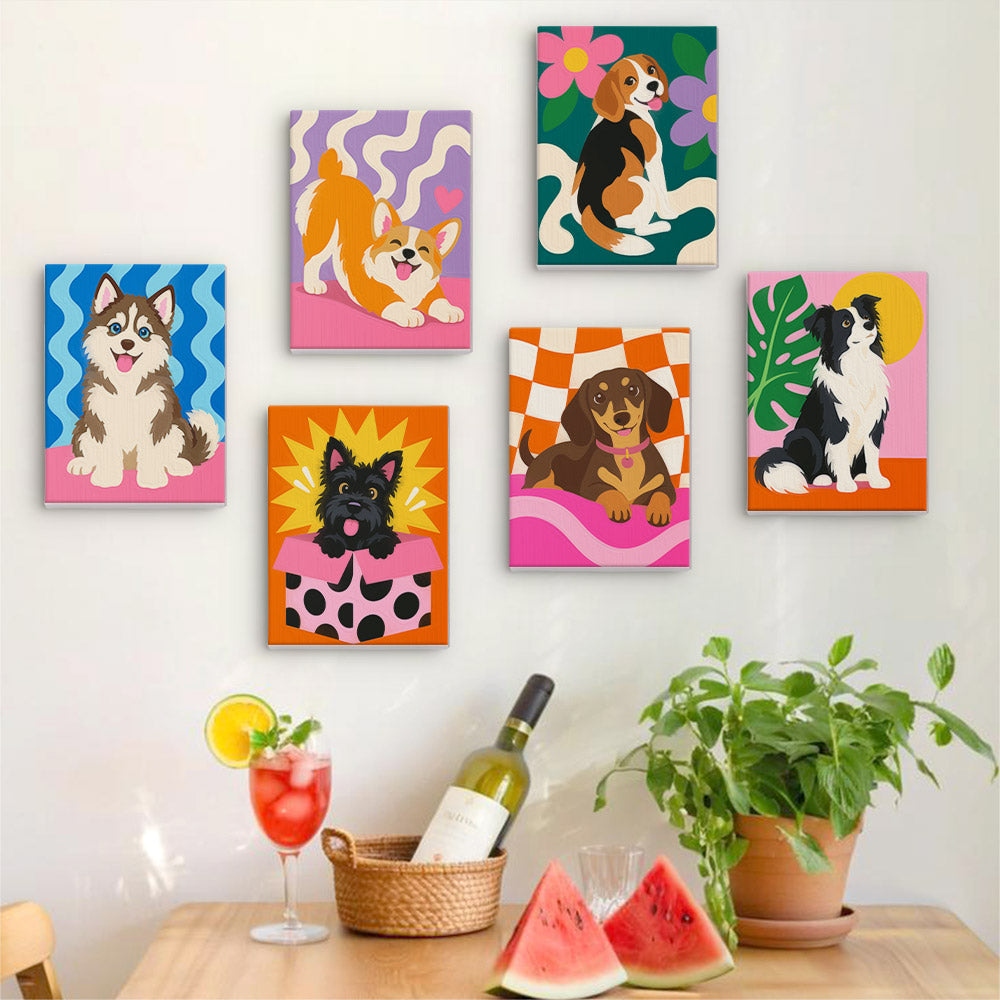 Six finished Pop Pups mini paintings hung on a wall above a table