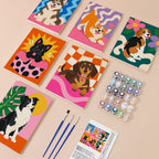 Pop Pups mini paint by numbers kit with six numbered canvases, acrylic paints, brushes and layout