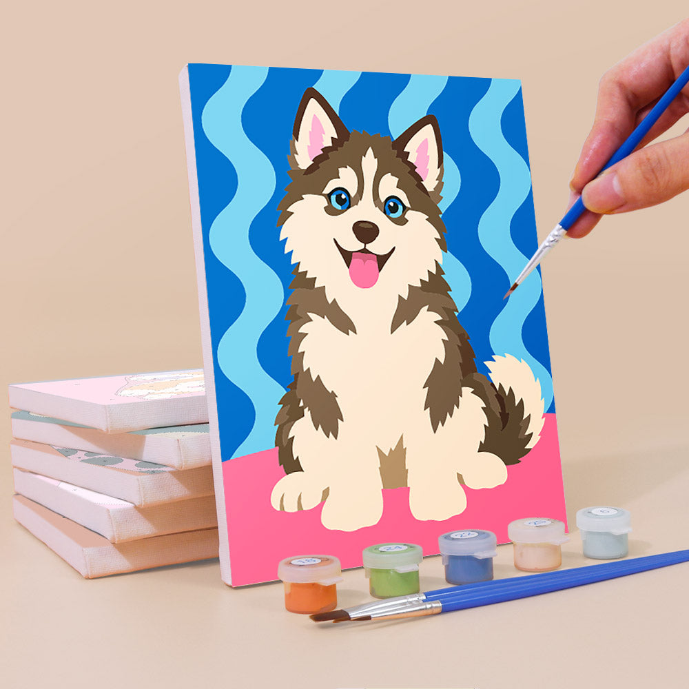 Painting a Pop Pups mini canvas propped up beside numbered acrylic paints