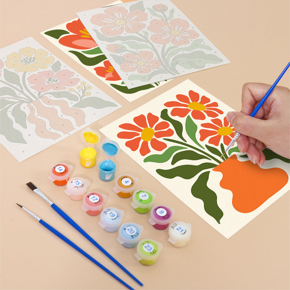 Filling in a Poppy Parade mini canvas with numbered acrylic paints and a fine brush