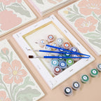 Numbered paint pots and brushes on a pre-stretched Poppy Parade mini canvas