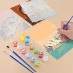 Filling in a Postcards from Afar mini canvas with numbered acrylic paints and a fine brush