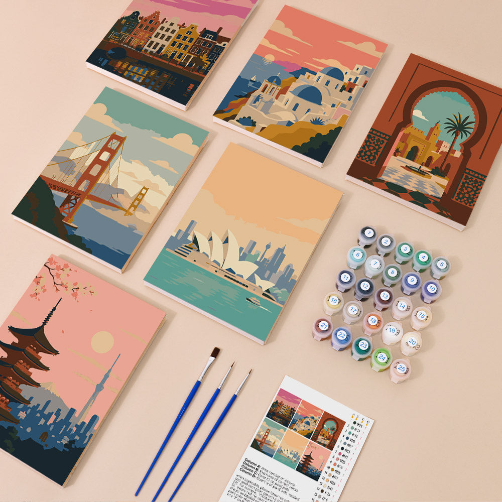 Postcards from Afar mini paint by numbers kit with six numbered canvases, acrylic paints, brushes and layout