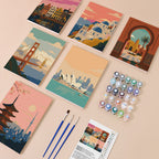 Postcards from Afar mini paint by numbers kit with six numbered canvases, acrylic paints, brushes and layout