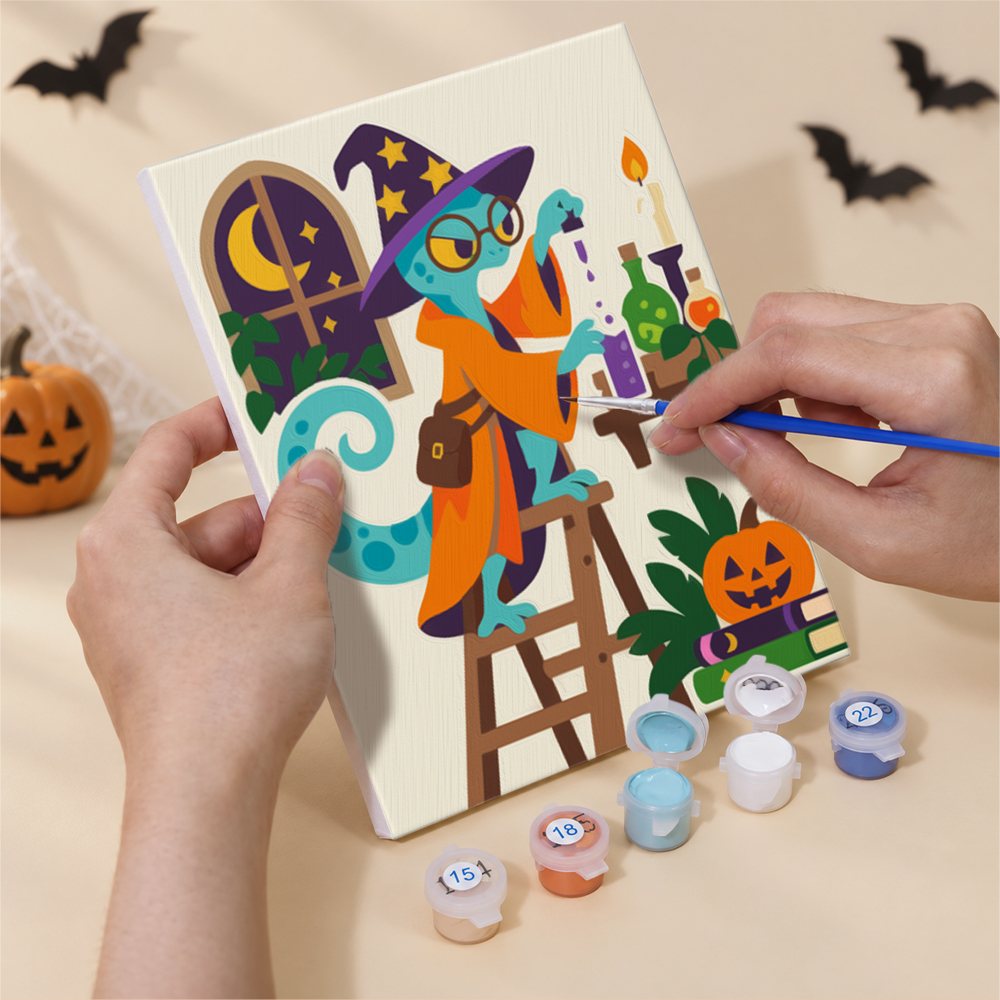 Hand holding a Potion Shop Animals mini canvas while painting the details