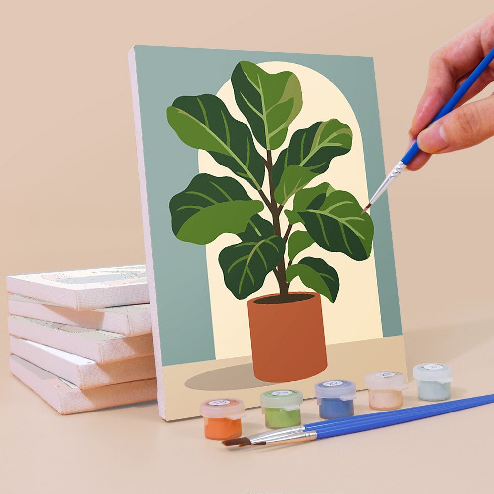 Painting a Potted Greens mini canvas propped up beside numbered acrylic paints