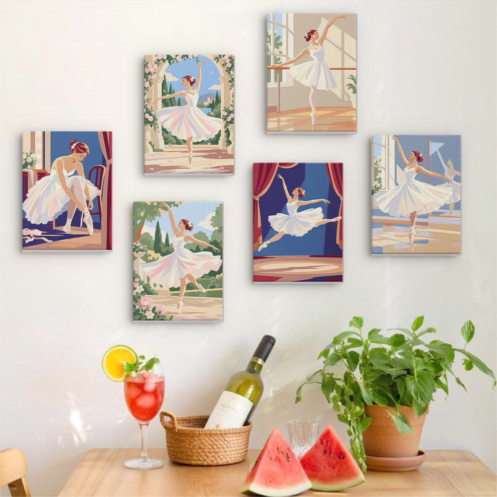 Six finished Prima Ballerina mini paintings hung on a wall above a table
