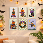 Six finished Pumpkin Festivities mini paintings hung on a wall above a table