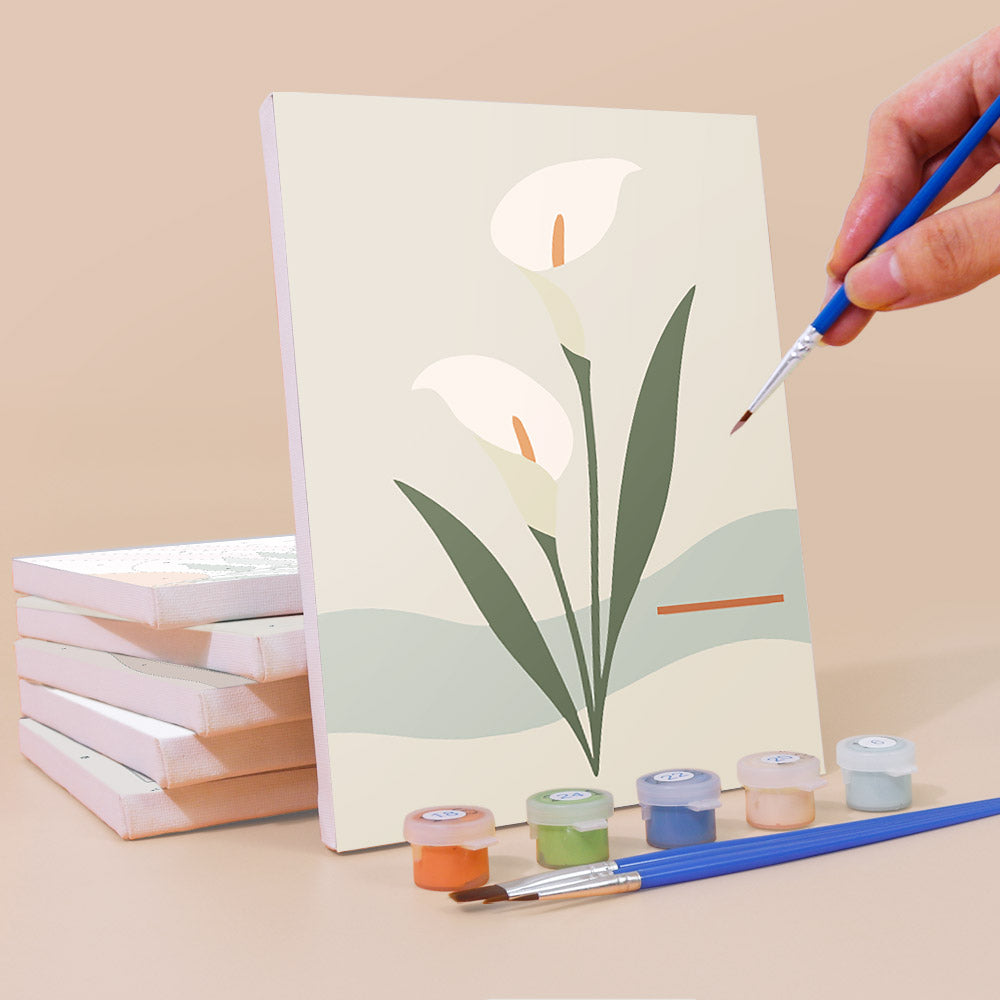 Painting a Quiet Botanicals mini canvas propped up beside numbered acrylic paints