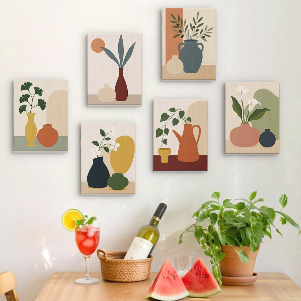 Six finished Quiet Vessels mini paintings hung on a wall above a table