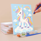 Painting a Rainbow Unicorns mini canvas propped up beside numbered acrylic paints