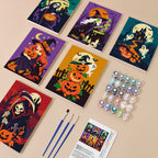 Painting one of the Reapers and Witches designs next to a stack of mini canvases
