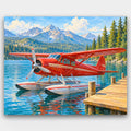 Red Seaplane at the Dock paint by numbers kit of a vintage red seaplane moored at a lake dock with pines and mountains