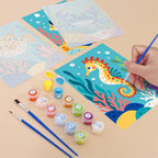 Filling in a Reef Friends mini canvas with numbered acrylic paints and a fine brush