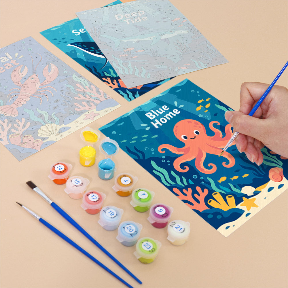 Filling in a Reef Joy mini canvas with numbered acrylic paints and a fine brush