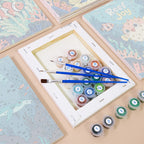 Numbered paint pots and brushes on a pre-stretched Reef Joy mini canvas