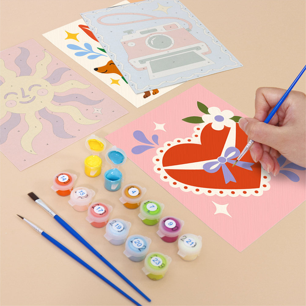 Filling in a Retro Charms mini canvas with numbered acrylic paints and a fine brush