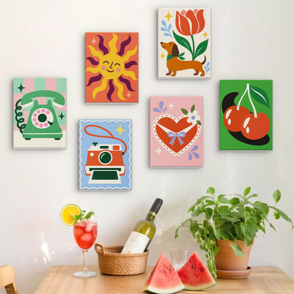 Six finished Retro Charms mini paintings hung on a wall above a table