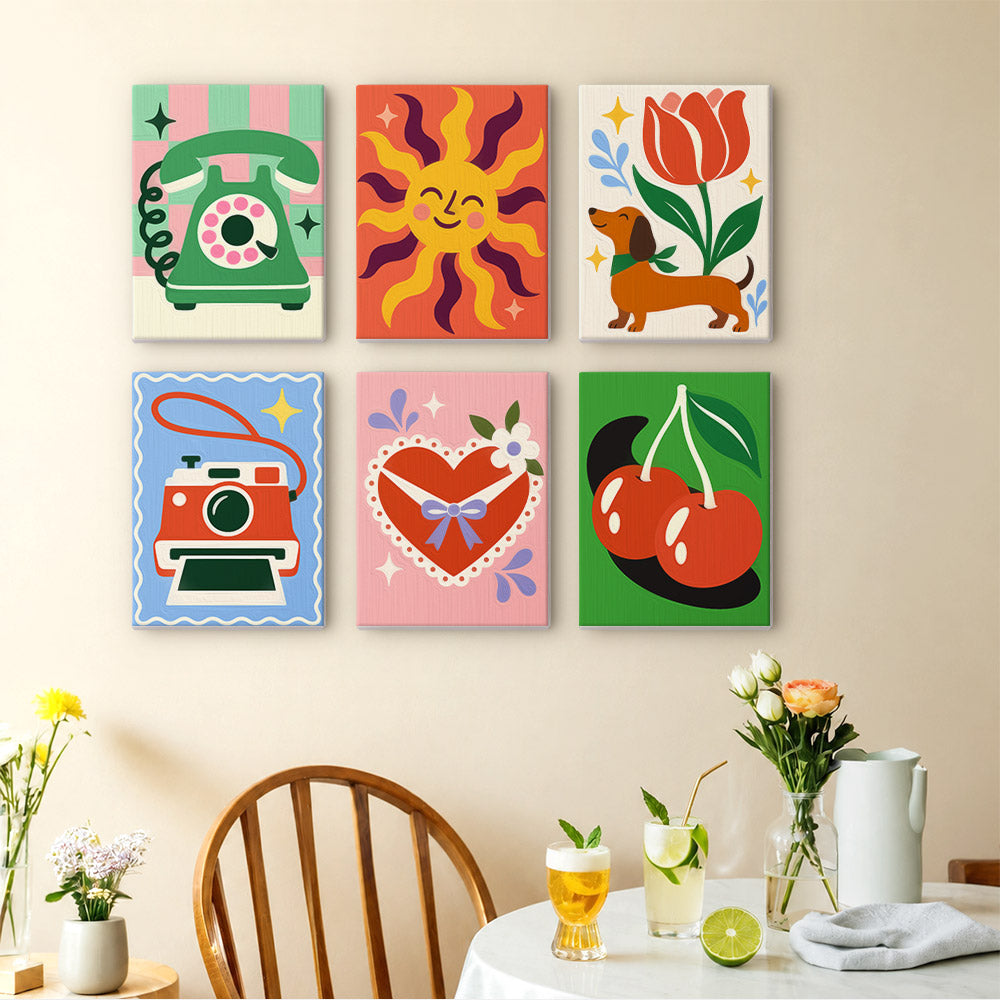 Retro Charms mini paintings displayed as a gallery wall in a sunny kitchen