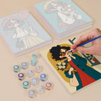 Painting one of the Retro Curls designs next to a stack of mini canvases