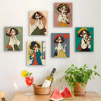 Six finished Retro Curls mini paintings hung on a wall above a table