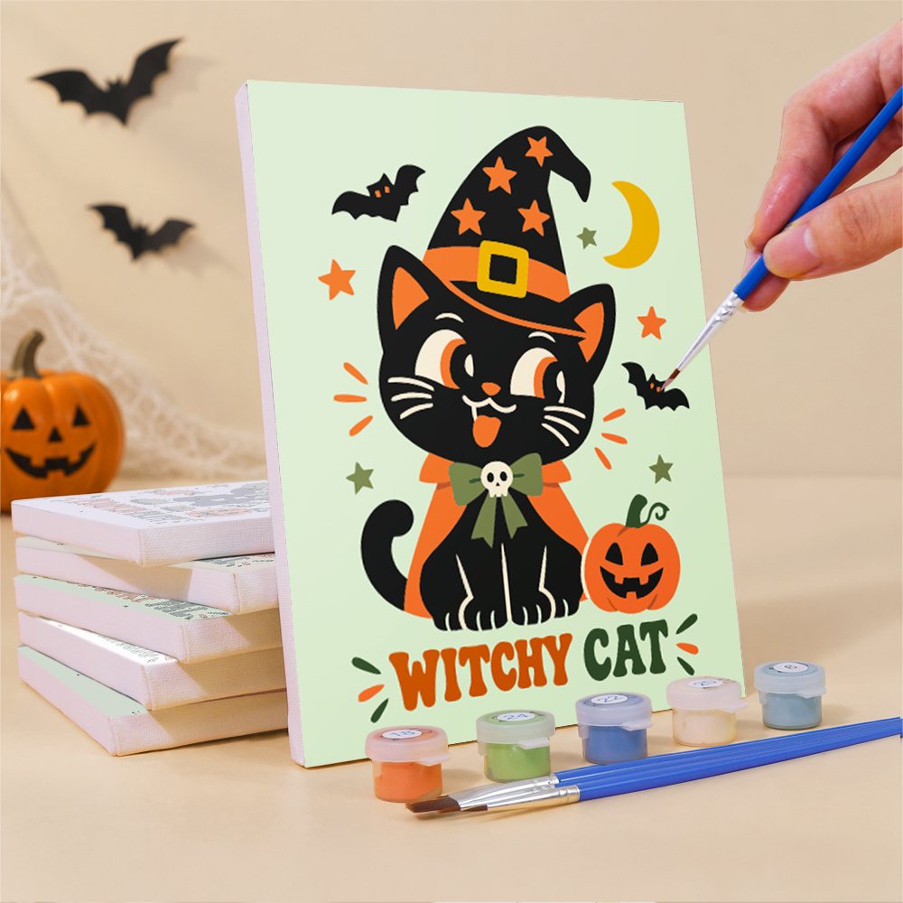 Painting a Retro Spooky Pals mini canvas propped up beside numbered acrylic paints