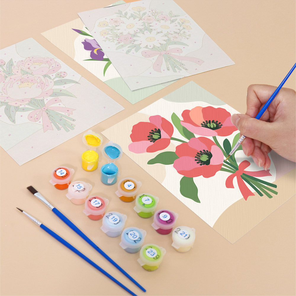 Filling in a Ribbon Bouquets mini canvas with numbered acrylic paints and a fine brush