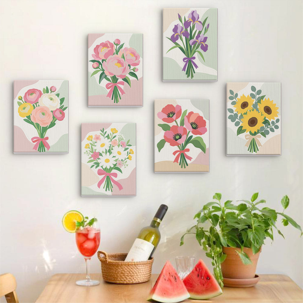 Six finished Ribbon Bouquets mini paintings hung on a wall above a table