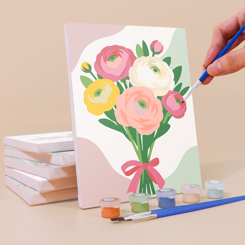 Painting a Ribbon Bouquets mini canvas propped up beside numbered acrylic paints