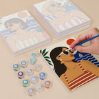Painting one of the Riviera Chic designs next to a stack of mini canvases