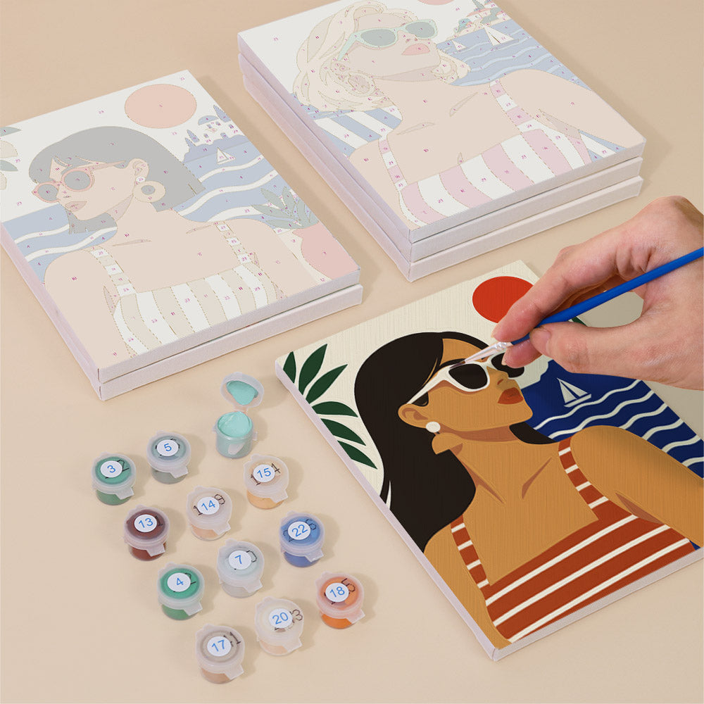 Painting one of the Riviera Chic designs next to a stack of mini canvases