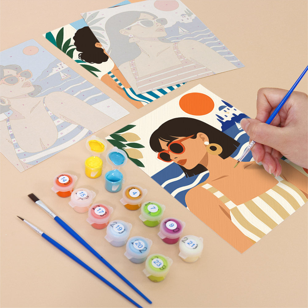 Filling in a Riviera Chic mini canvas with numbered acrylic paints and a fine brush