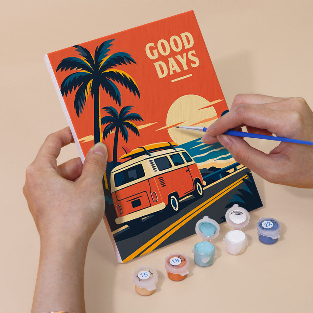 Hand holding a Road Trip Posters mini canvas while painting the details