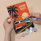 Hand holding a Road Trip Posters mini canvas while painting the details