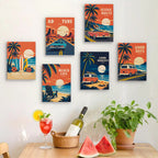 Six finished Road Trip Posters mini paintings hung on a wall above a table