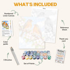What's included in the Robins in Blossom paint by numbers kit: numbered linen canvas, reference sheet, color guide, 24 acrylic paints, 3 brushes and thank you card