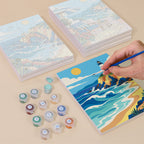 Painting one of the Rolling Waves designs next to a stack of mini canvases