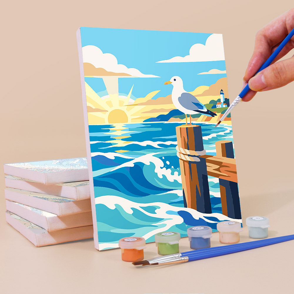 Painting a Rolling Waves mini canvas propped up beside numbered acrylic paints