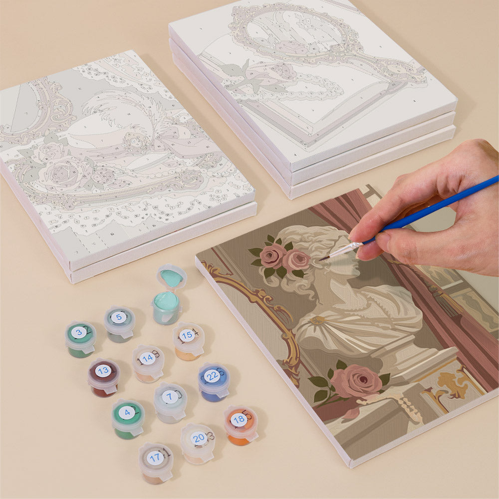 Painting one of the Rose Boudoir designs next to a stack of mini canvases