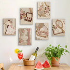 Six finished Rose Boudoir mini paintings hung on a wall above a table