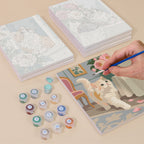 Painting one of the Roses and Whiskers designs next to a stack of mini canvases