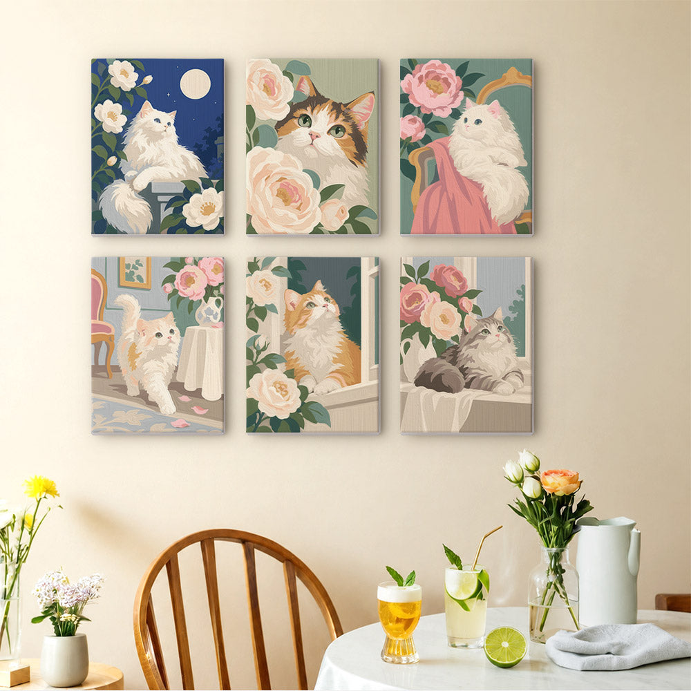 Roses and Whiskers mini paintings displayed as a gallery wall in a sunny kitchen