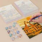 Painting one of the Safari Sunset designs next to a stack of mini canvases