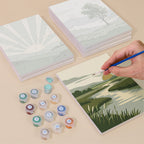 Painting one of the Sage Horizons designs next to a stack of mini canvases