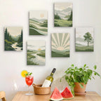 Six finished Sage Horizons mini paintings hung on a wall above a table