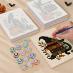 Painting one of the Salem Black Cat Autumn designs next to a stack of mini canvases