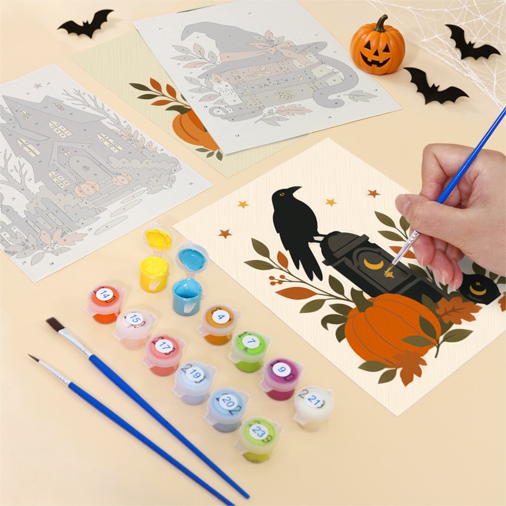 Filling in a Salem Black Cat Autumn mini canvas with numbered acrylic paints and a fine brush